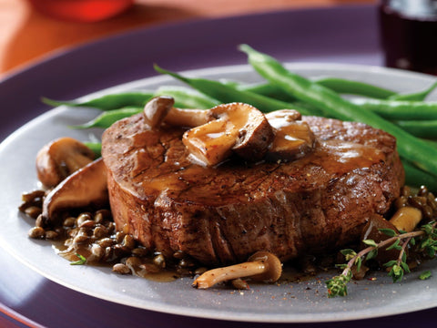 Beef tenderloin with savory saucy mushrooms and lentils