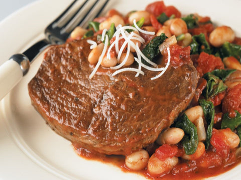 Braised beef with tomato-garlic white beans